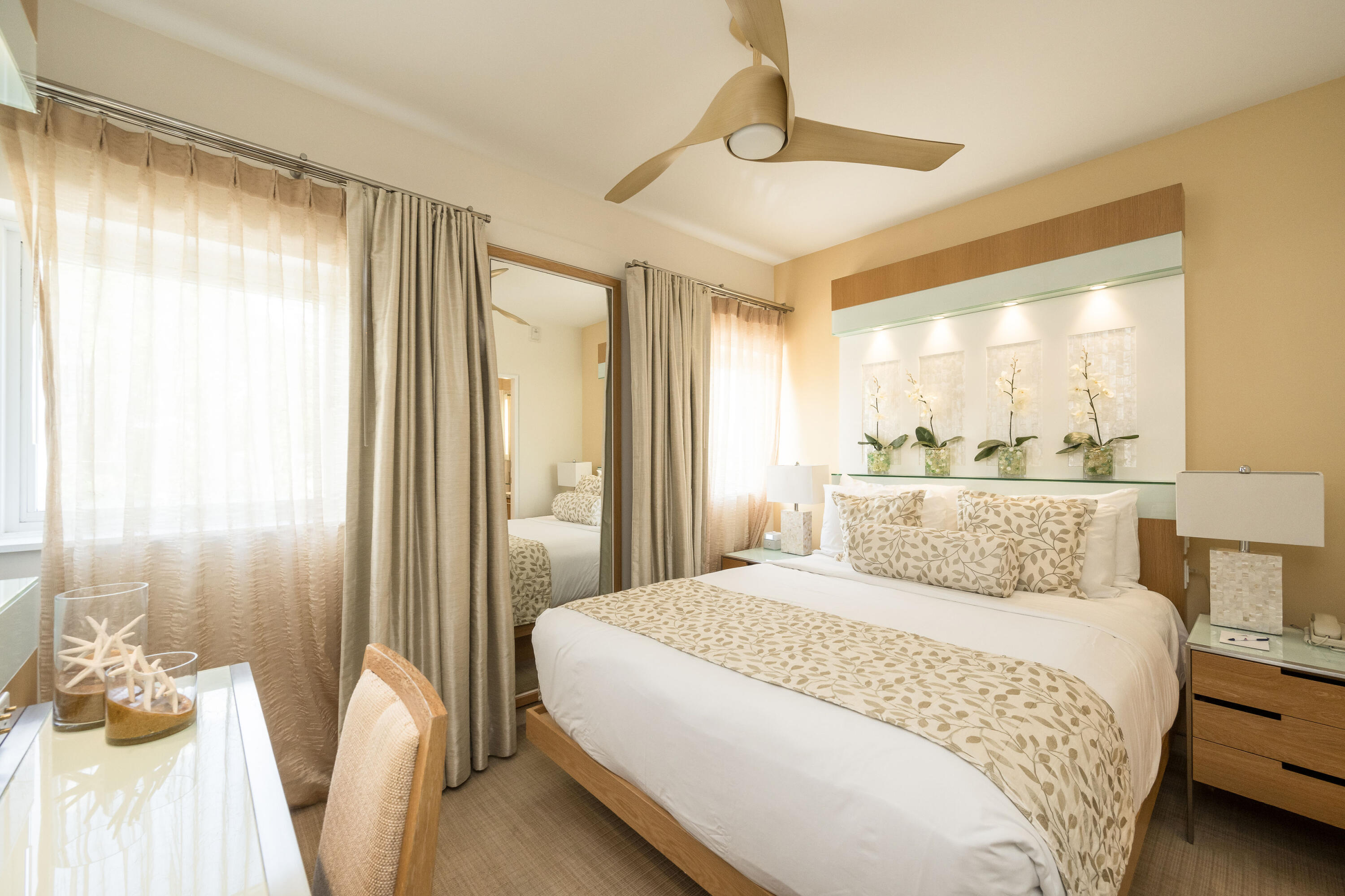 1401 Simonton Street, Unit 20 Key West, FL 33040 - Photo 14 of 32 a bedroom with a bed and a large mirror