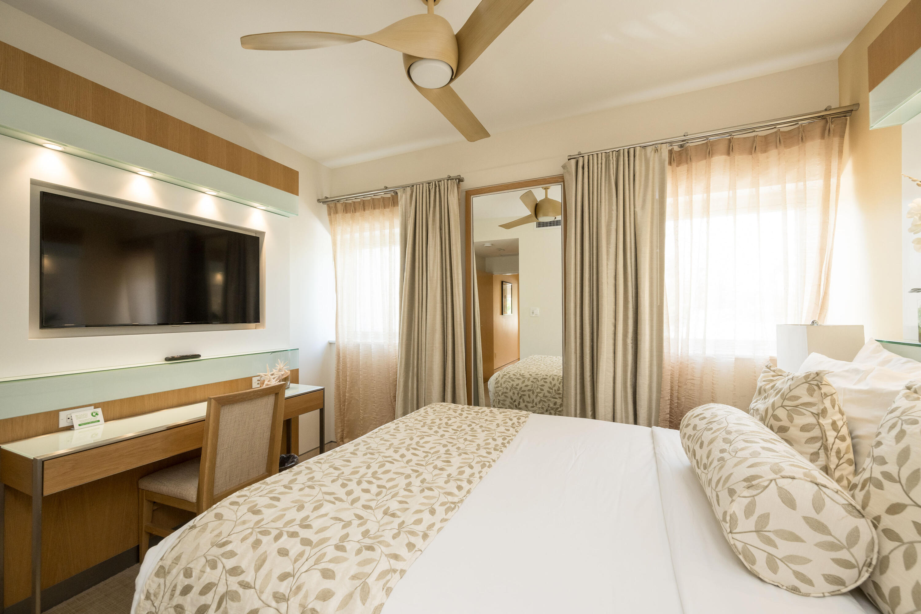 1401 Simonton Street, Unit 20 Key West, FL 33040 - Photo 16 of 32 a bedroom with a bed and a flat screen tv