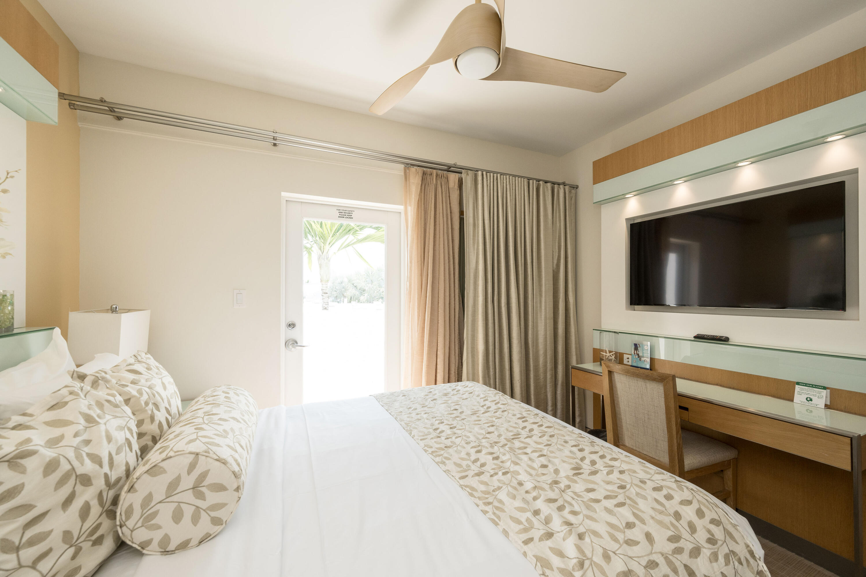 1401 Simonton Street, Unit 20 Key West, FL 33040 - Photo 20 of 32 a bedroom with a flat screen tv and a bed