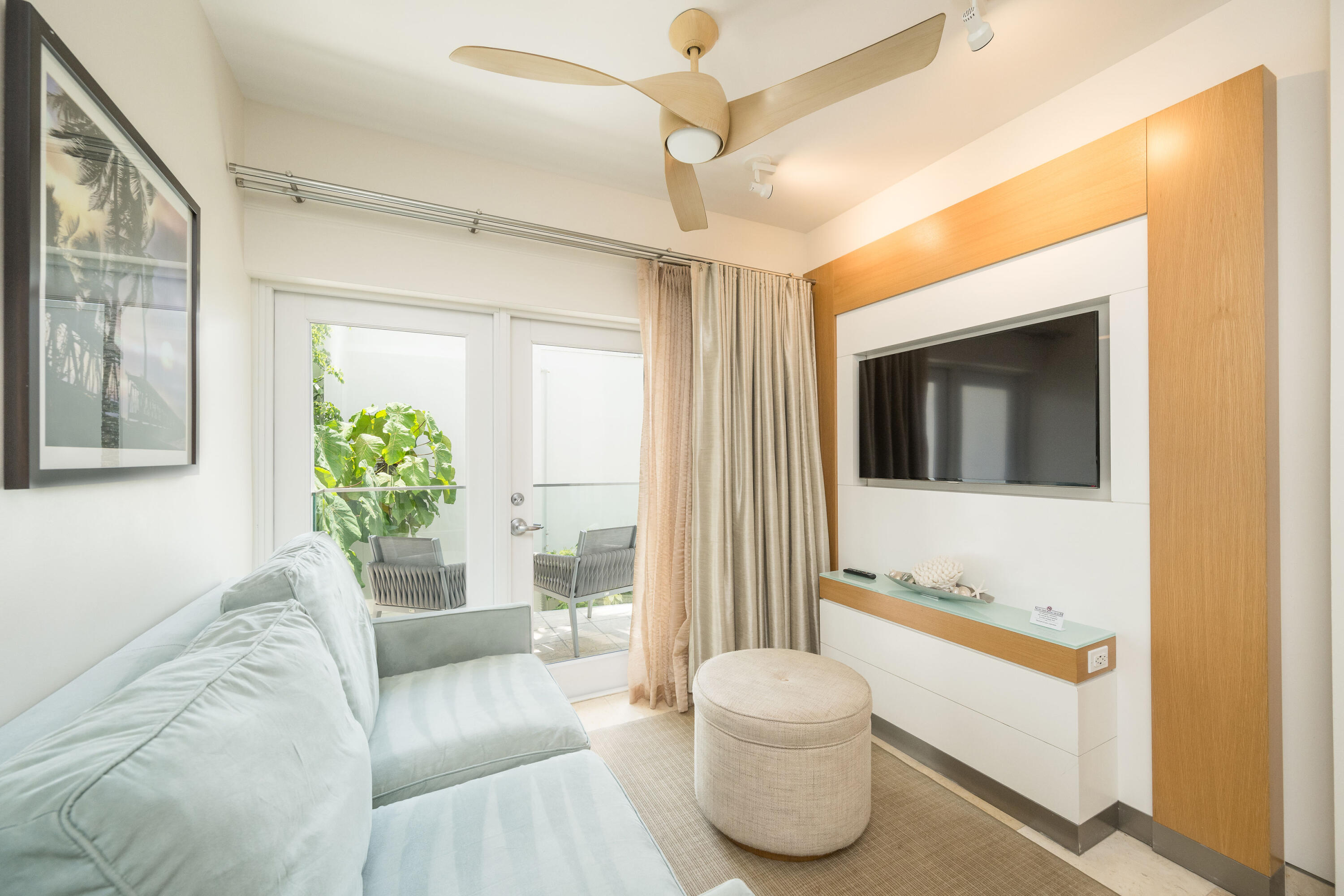 1401 Simonton Street, Unit 20 Key West, FL 33040 - Photo 6 of 32 a living room with furniture and a large window