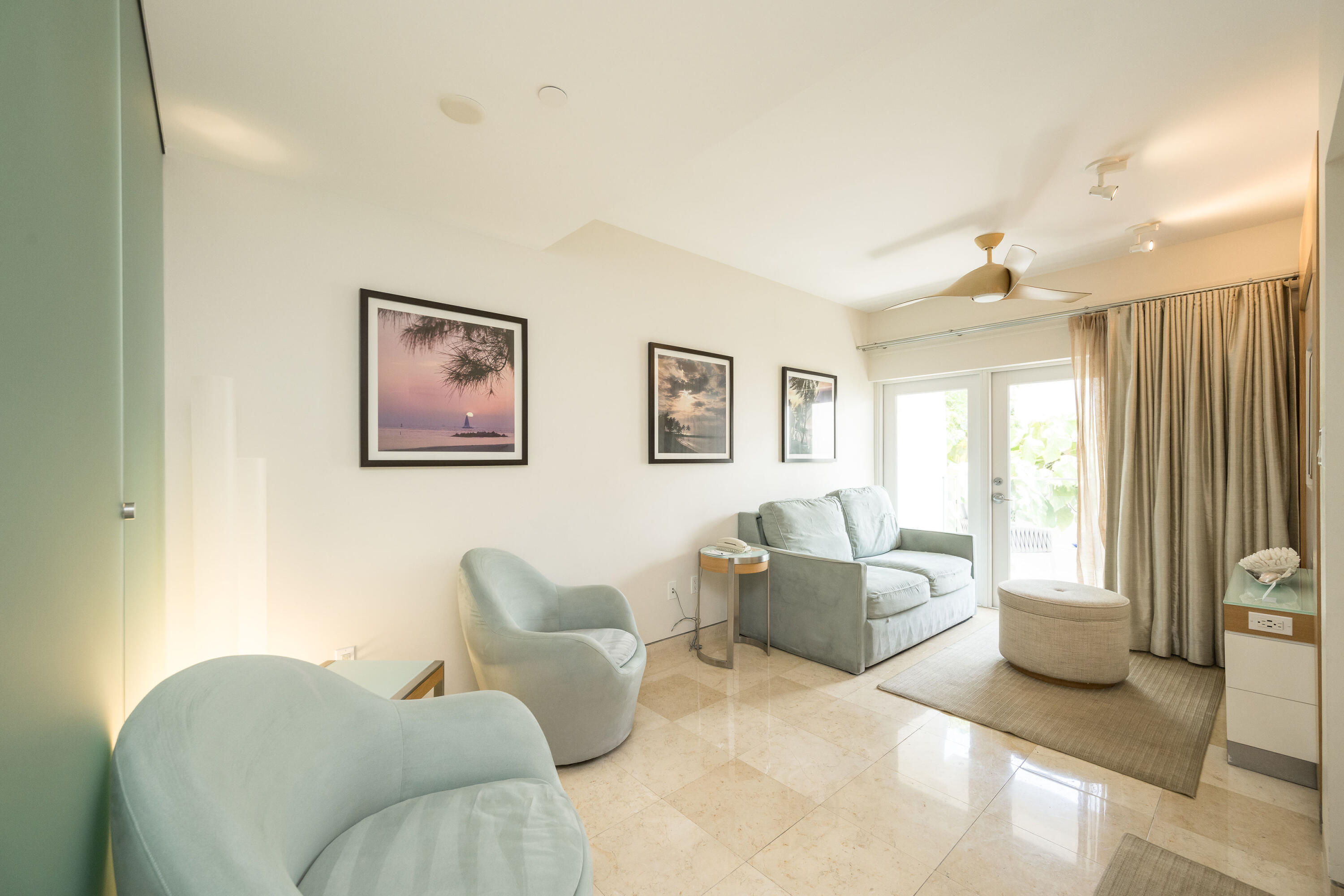 1401 Simonton Street, Unit 20 Key West, FL 33040 - Photo 9 of 32 a living room with furniture and a large window