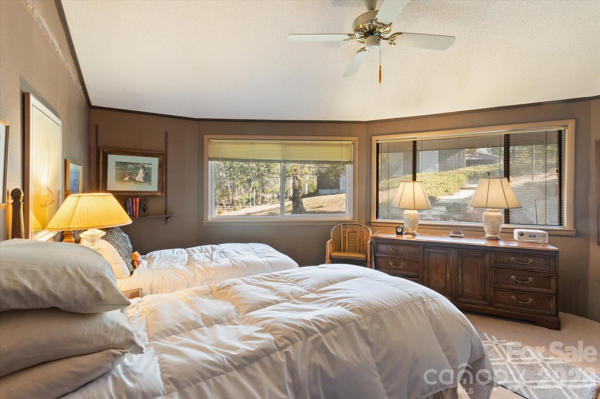 1881 Brookside Camp Road Hendersonville, NC 28792 - Photo 21 of 48 a bedroom with a large bed and a window