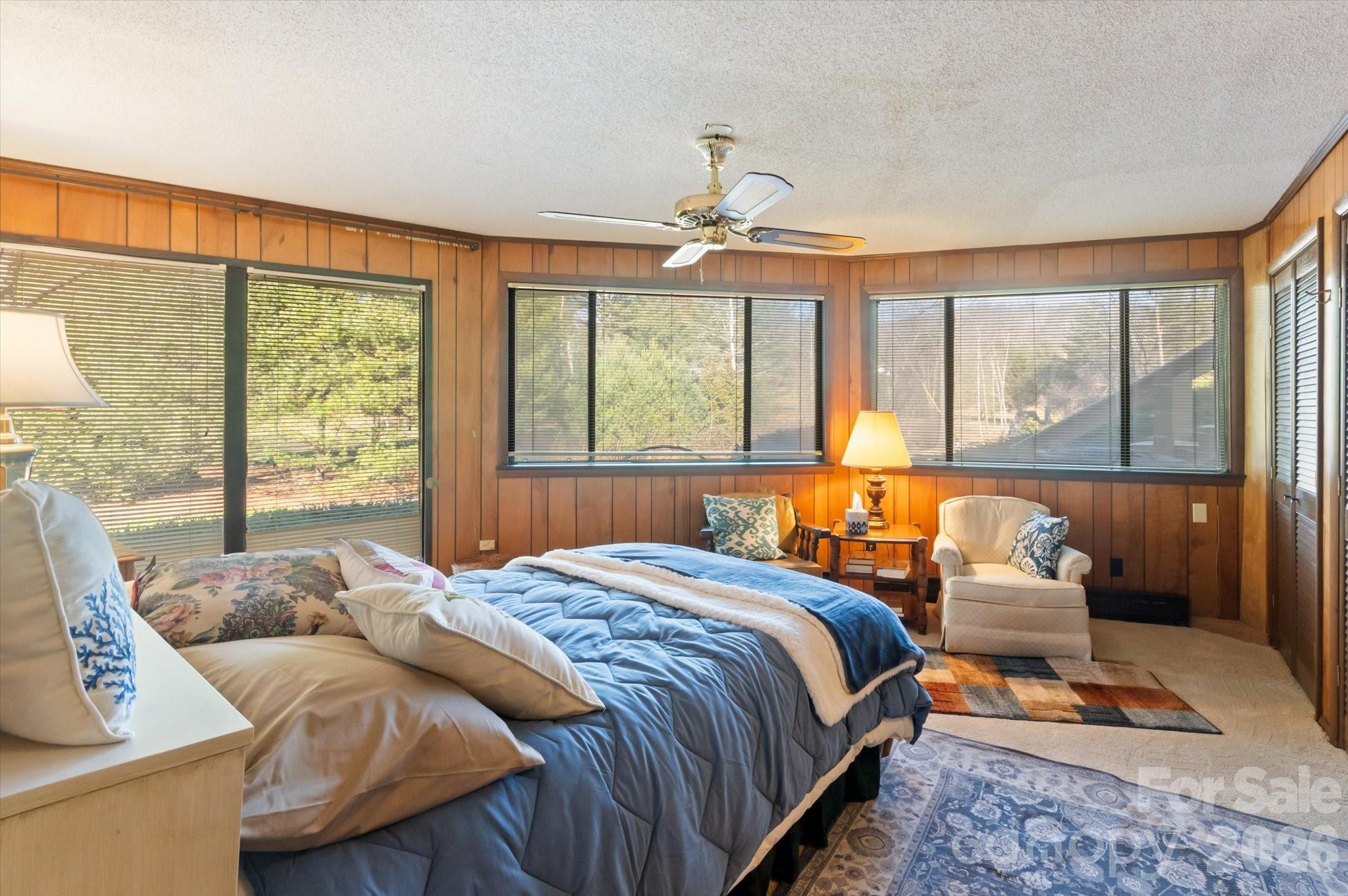 1881 Brookside Camp Road Hendersonville, NC 28792 - Photo 25 of 48 a bedroom with a bed and a couch