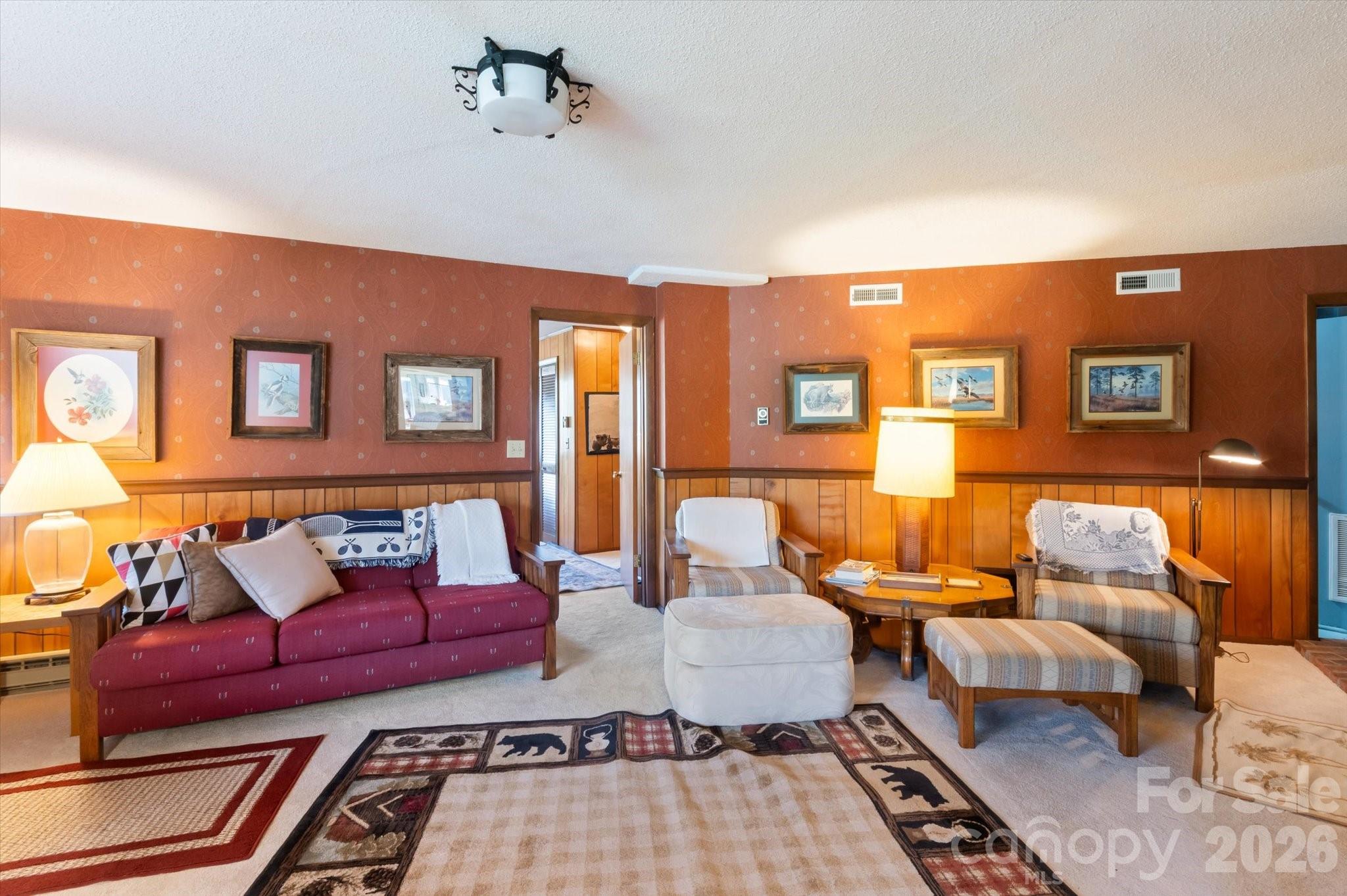 1881 Brookside Camp Road Hendersonville, NC 28792 - Photo 29 of 48 a living room with furniture and wooden floor
