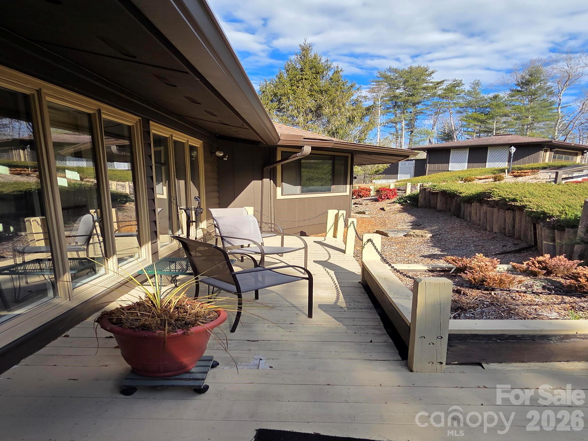 1881 Brookside Camp Road Hendersonville, NC 28792 - Photo 47 of 48 a view of a patio with couches chairs and potted plants