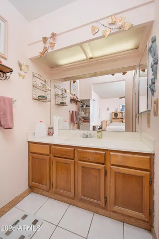 a spacious bathroom with a sink a mirror and a vanity