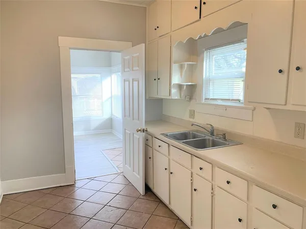 a bathroom with a sink a vanity and a mirror