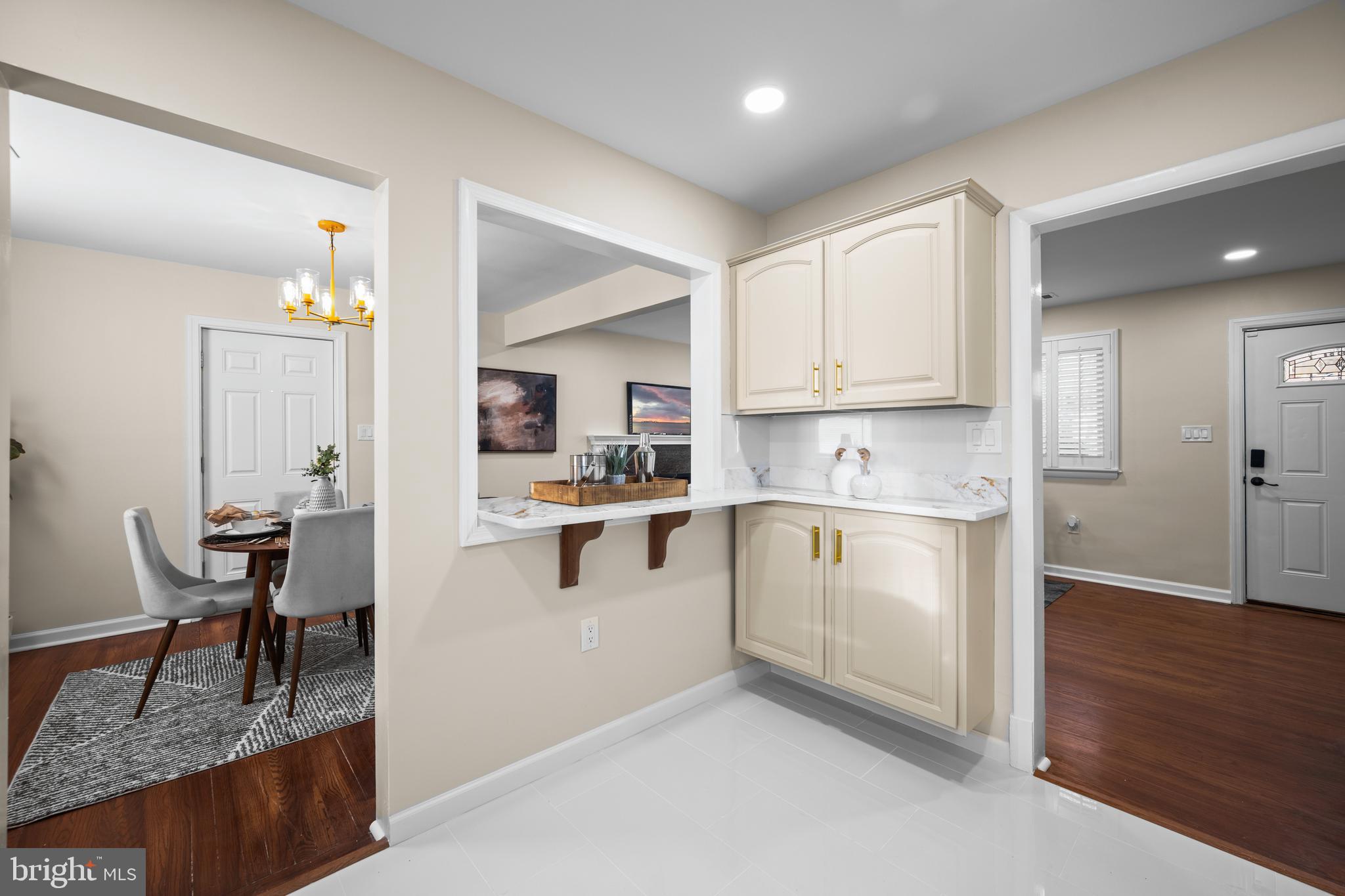 8711 Windsor Mill Road Windsor Mill, MD 21244 - Photo 12 of 35 a kitchen with white cabinets and sink