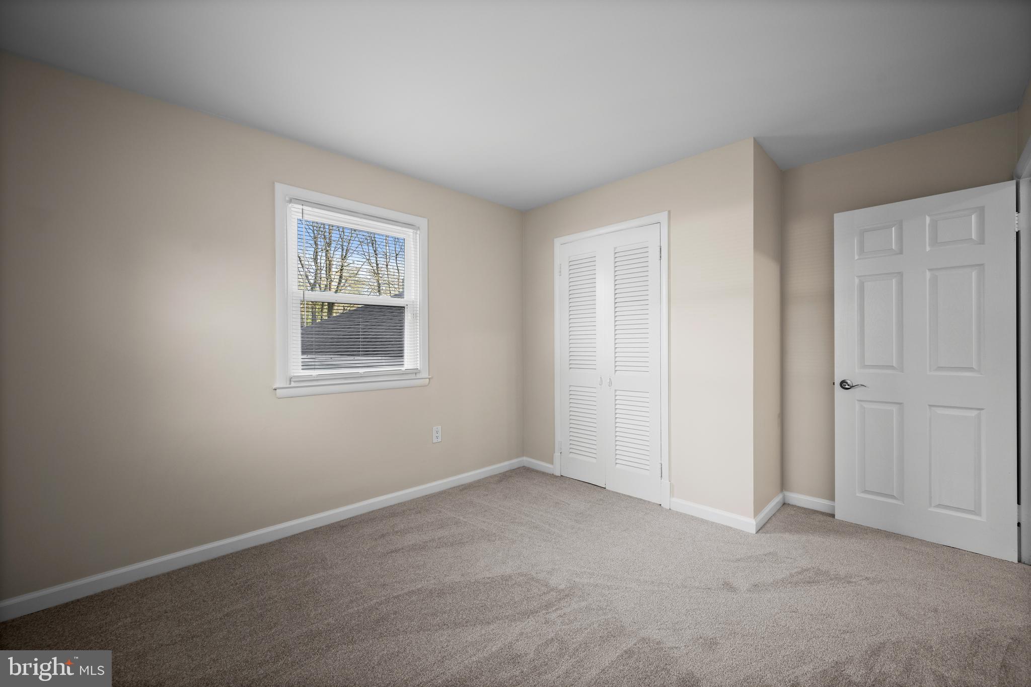 8711 Windsor Mill Road Windsor Mill, MD 21244 - Photo 21 of 36 an empty room with windows