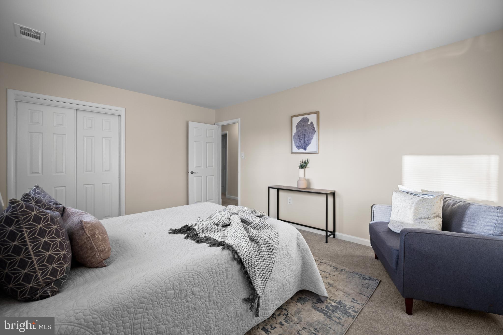 8711 Windsor Mill Road Windsor Mill, MD 21244 - Photo 21 of 35 a bedroom with a bed and a couch