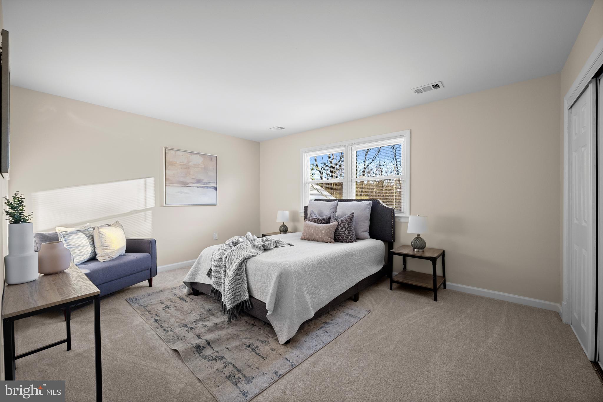 8711 Windsor Mill Road Windsor Mill, MD 21244 - Photo 23 of 35 a bed room with a bed and a chair