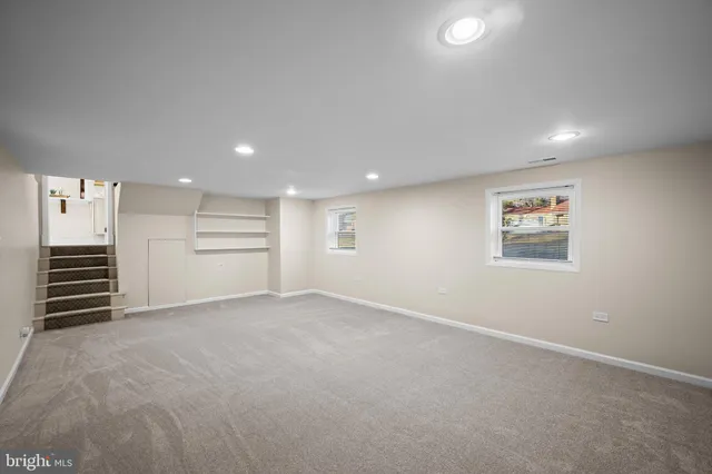 a view of an empty room with a cabinet