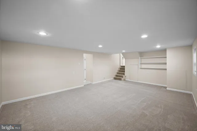a view of an empty room with a closet