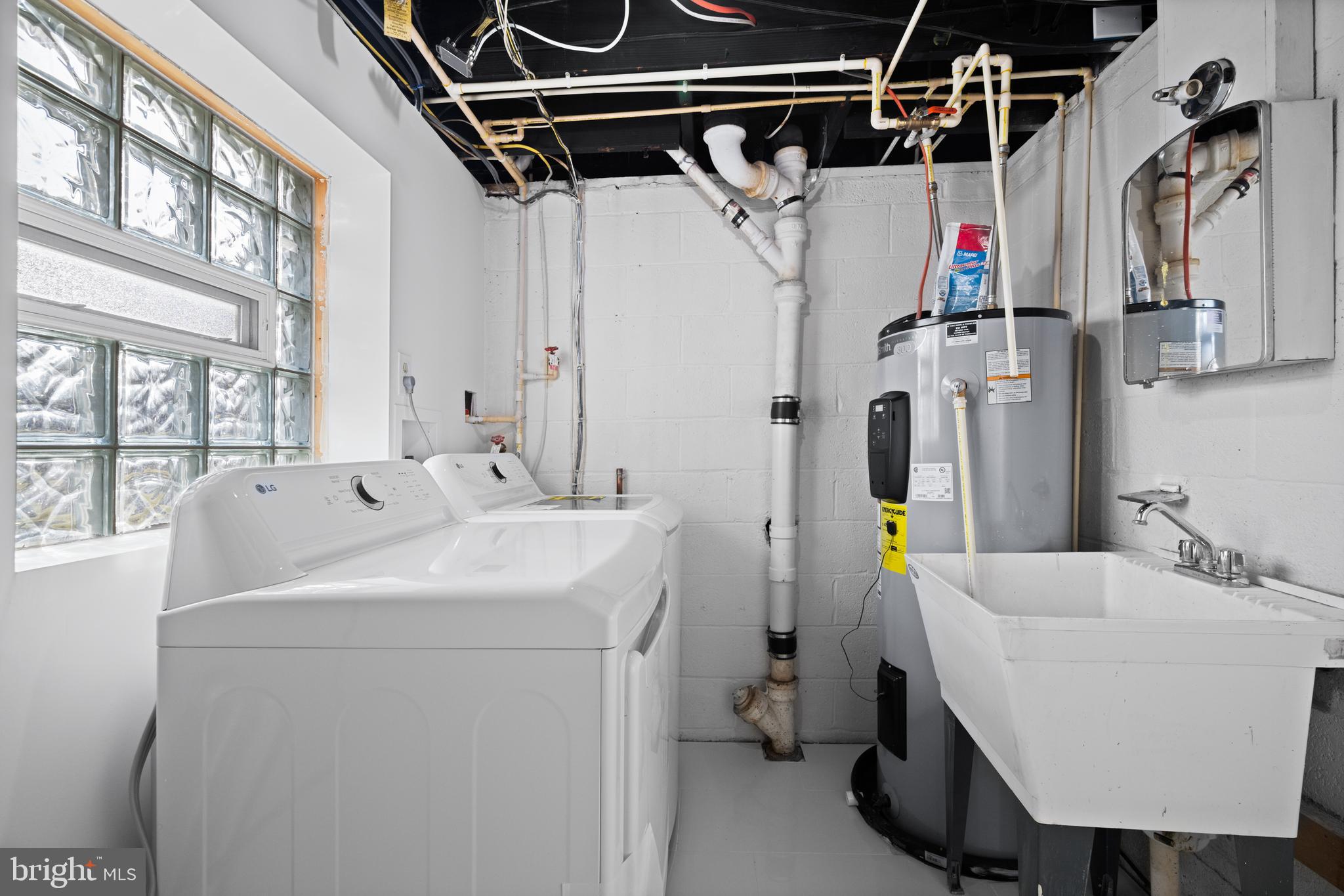 8711 Windsor Mill Road Windsor Mill, MD 21244 - Photo 28 of 36 a utility room with dryer and washer