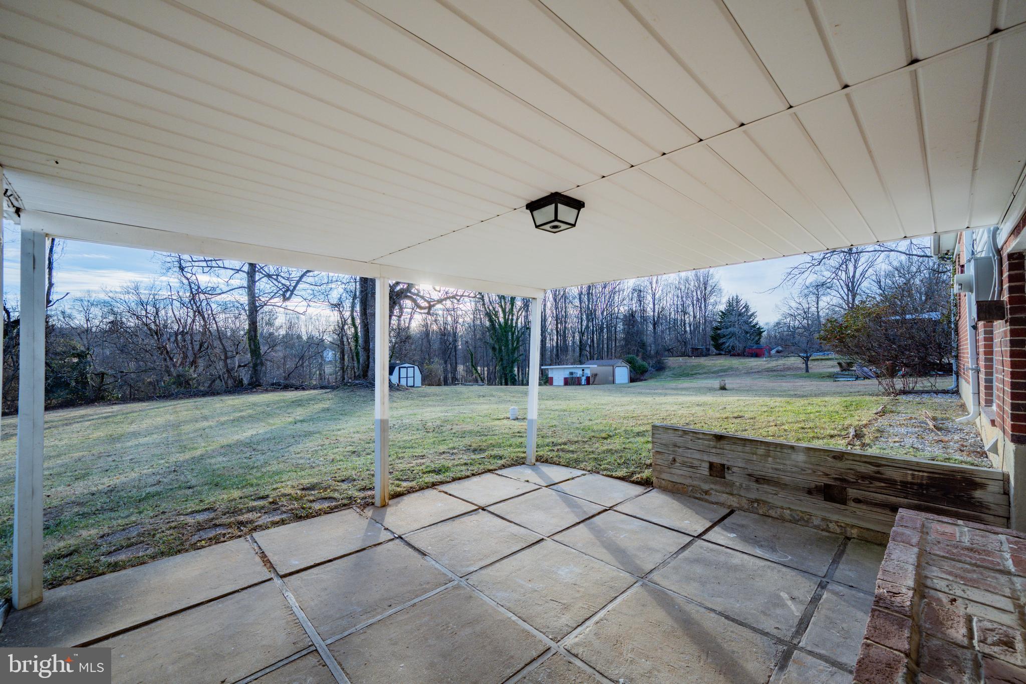 8711 Windsor Mill Road Windsor Mill, MD 21244 - Photo 30 of 35 a view of a house and a backyard and a garden