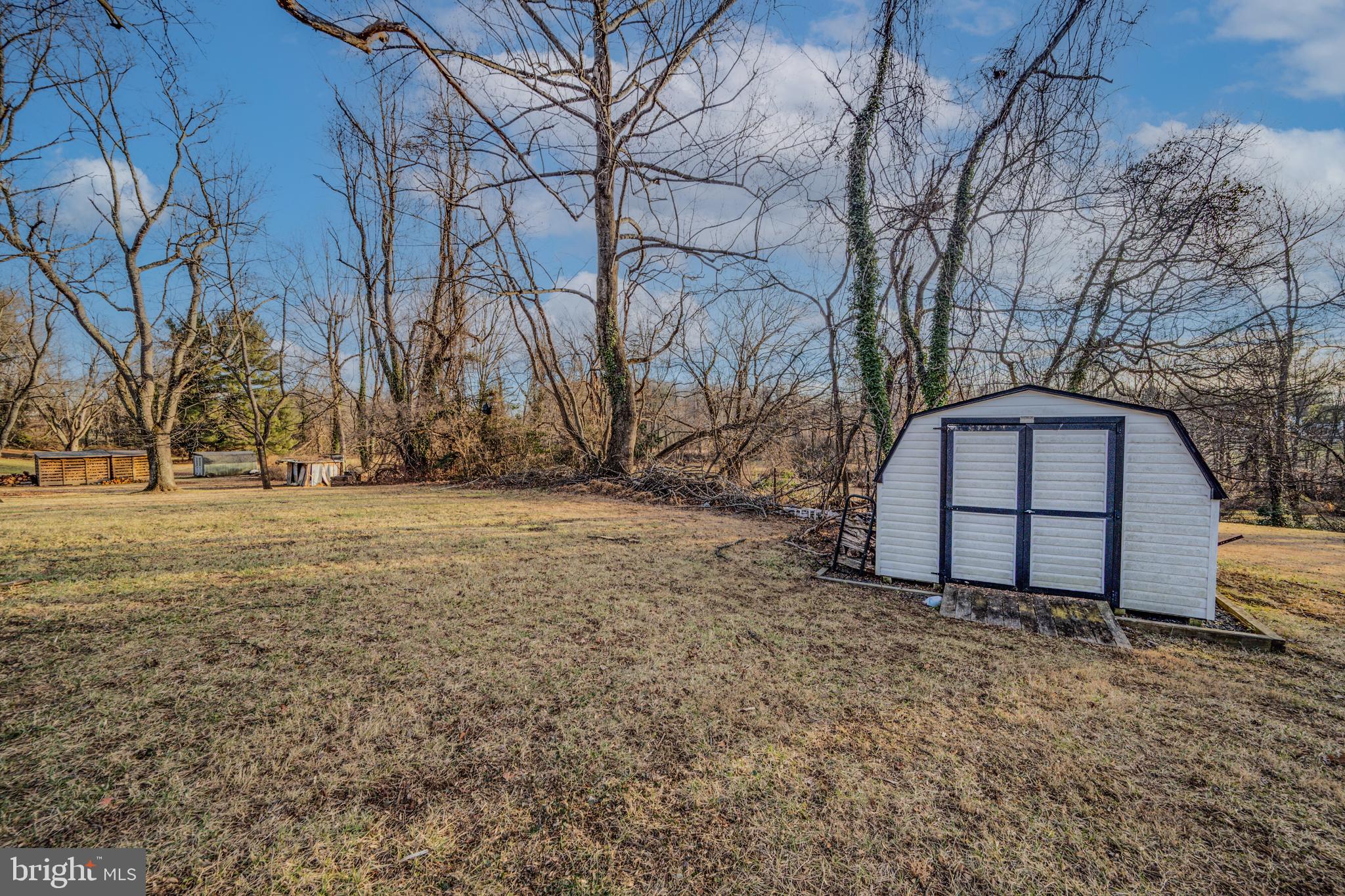 8711 Windsor Mill Road Windsor Mill, MD 21244 - Photo 33 of 35 a view of backyard with wooden fence and large trees