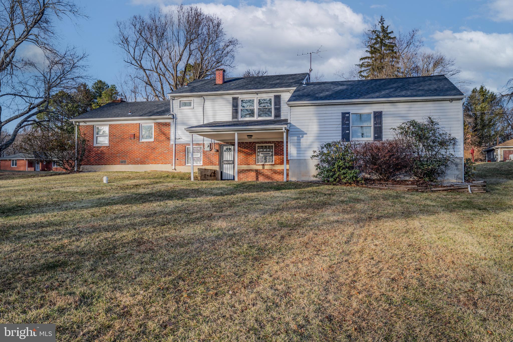 8711 Windsor Mill Road Windsor Mill, MD 21244 - Photo 35 of 35 a front view of a house with a yard