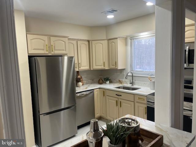 8711 Windsor Mill Road Windsor Mill, MD 21244 - Photo 6 of 36 a kitchen with stainless steel appliances granite countertop a refrigerator and a sink