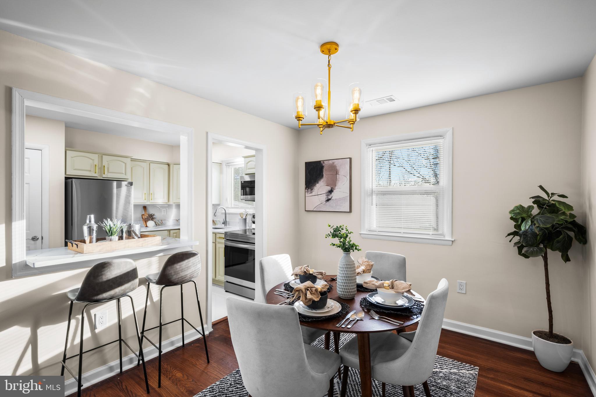 8711 Windsor Mill Road Windsor Mill, MD 21244 - Photo 8 of 35 a view of a dining room with furniture and wooden floor