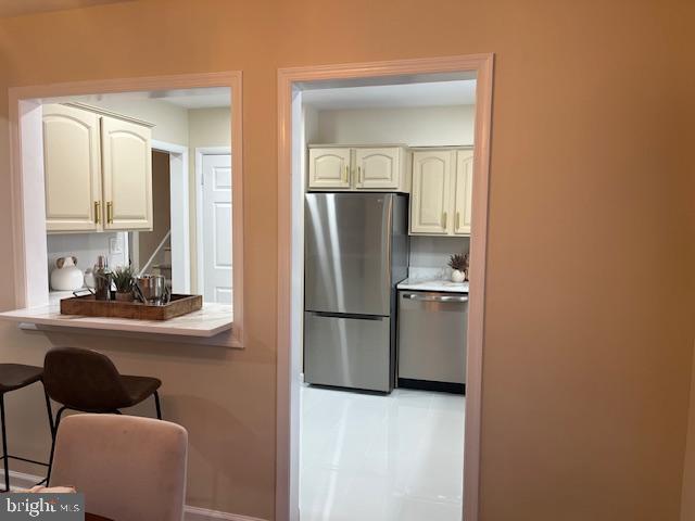 8711 Windsor Mill Road Windsor Mill, MD 21244 - Photo 8 of 36 a kitchen with a refrigerator and windows