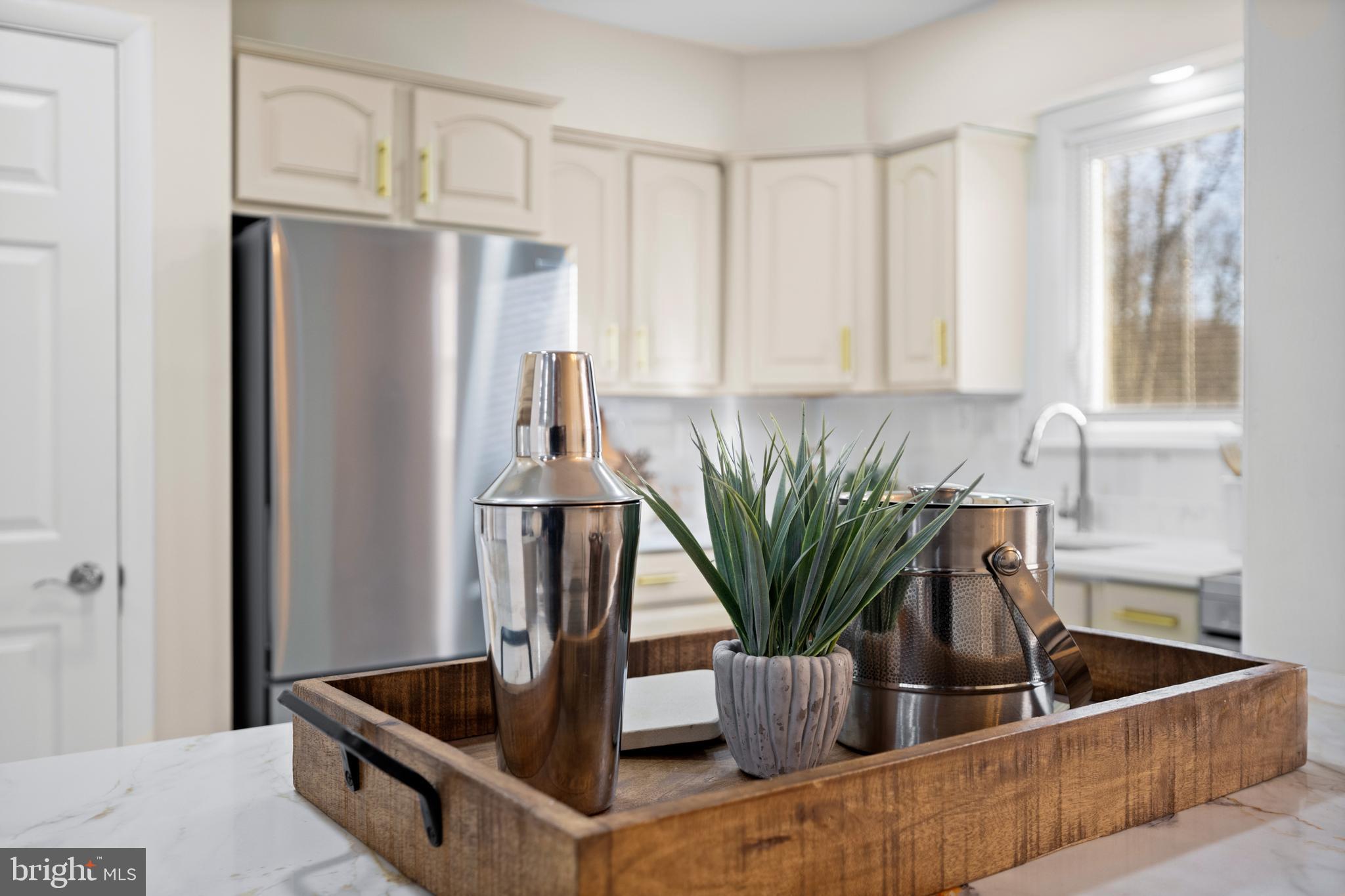 8711 Windsor Mill Road Windsor Mill, MD 21244 - Photo 9 of 35 a kitchen with stainless steel appliances granite countertop a refrigerator a sink and a counter