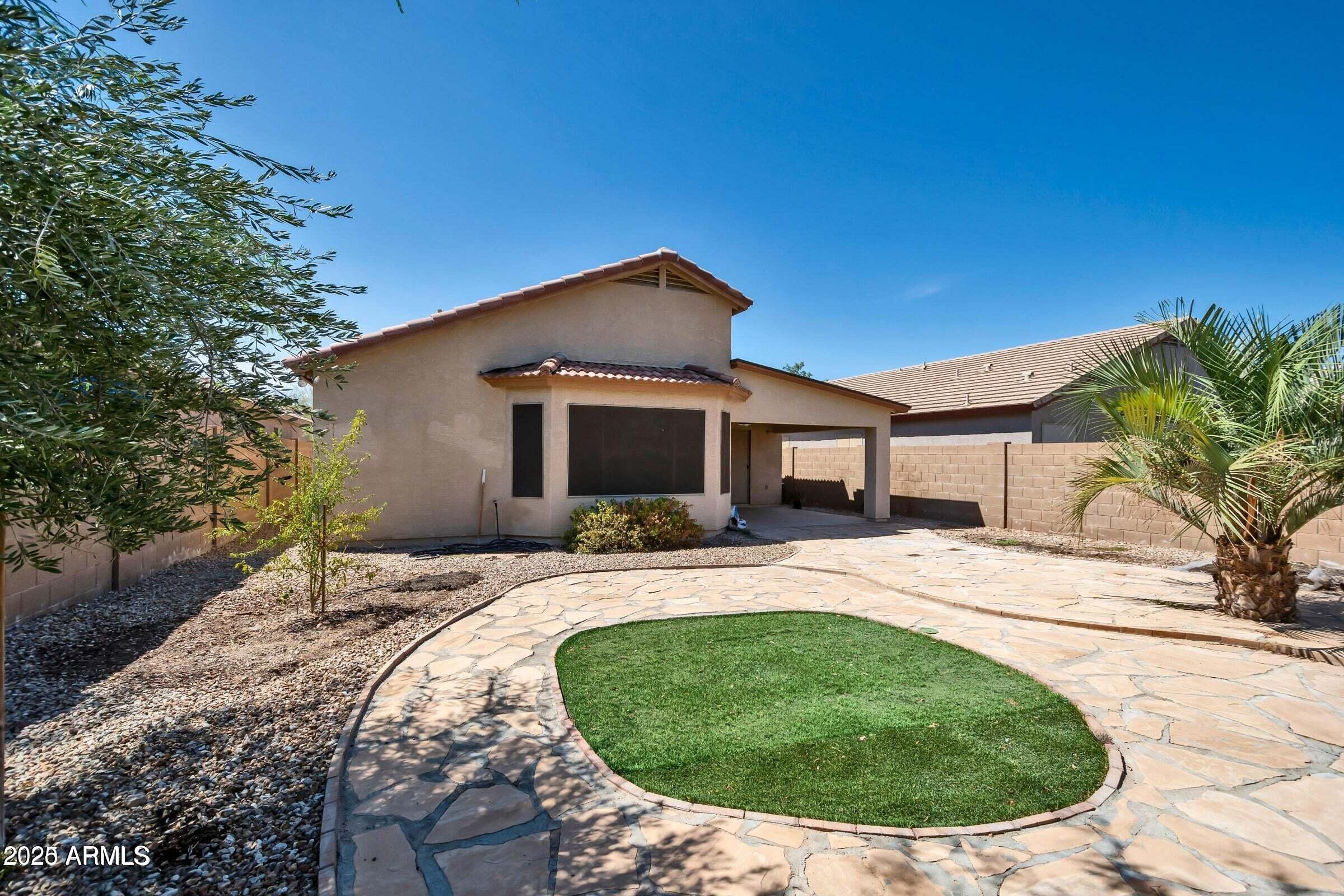 1228 East Elm Road San Tan Valley, AZ 85140 - Photo 12 of 13 a house view with a backyard space