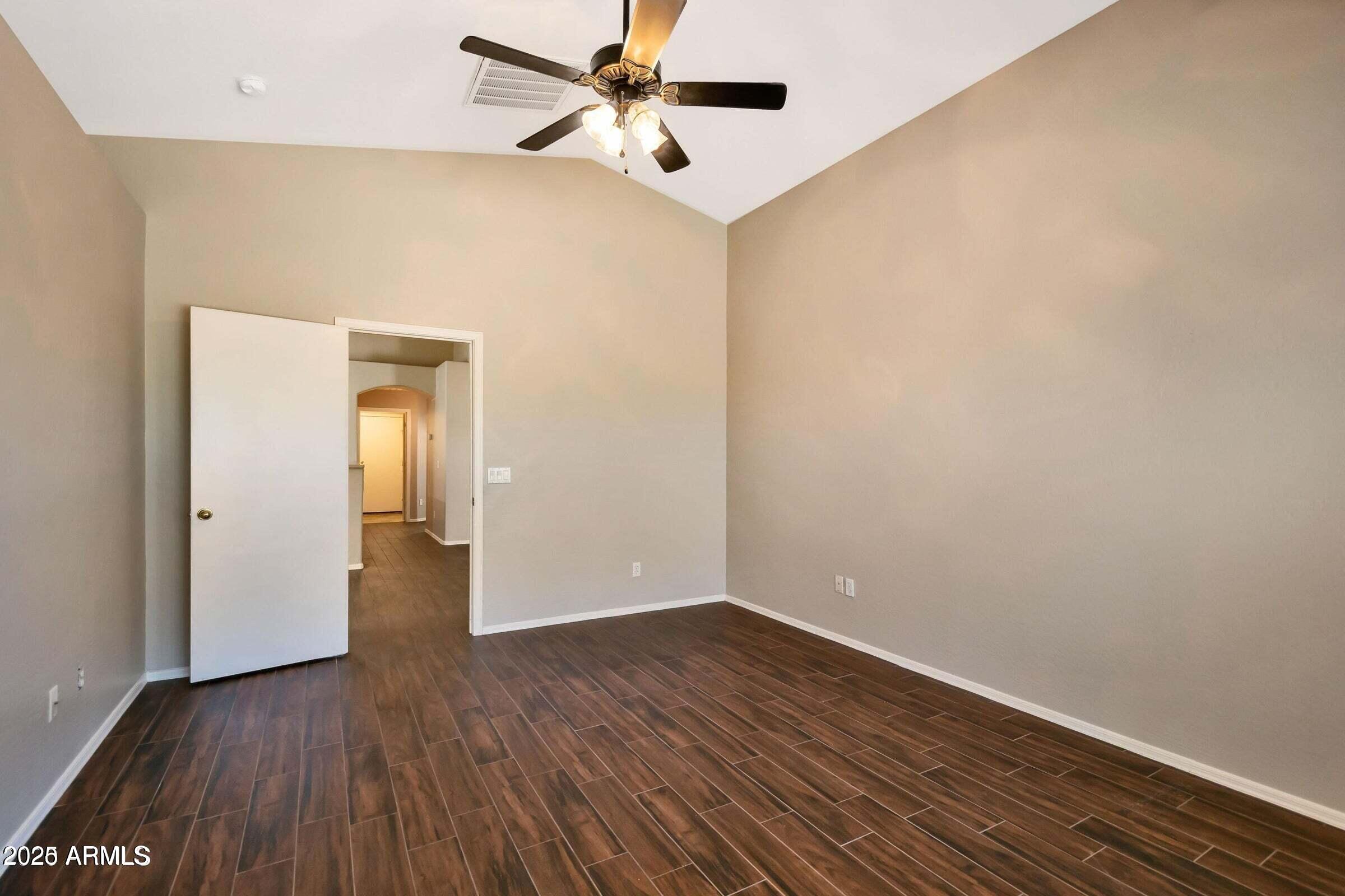 1228 East Elm Road San Tan Valley, AZ 85140 - Photo 6 of 13 a view of empty room with wooden floor