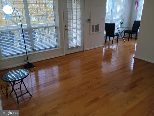 a view of a livingroom with furniture and wooden floor