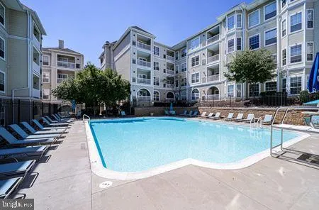 a view of a swimming pool with a lounge chairs