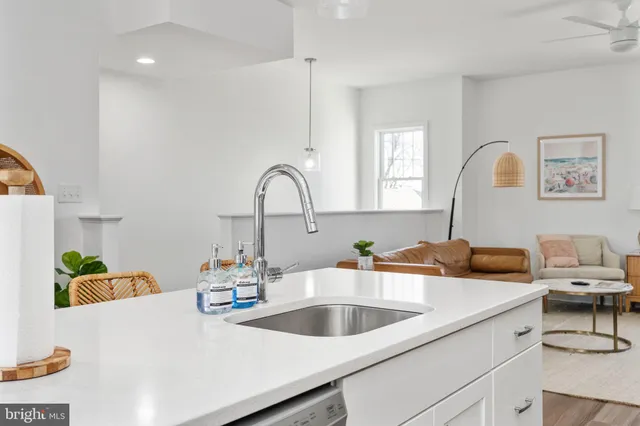 a view of a balcony with wooden floor and outdoor seating