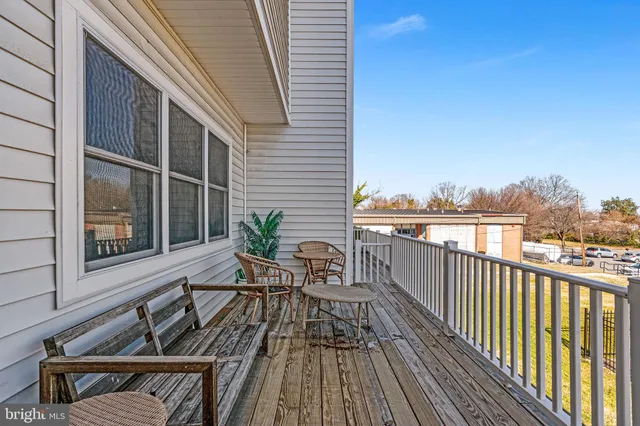 a bedroom with a large bed and a large window