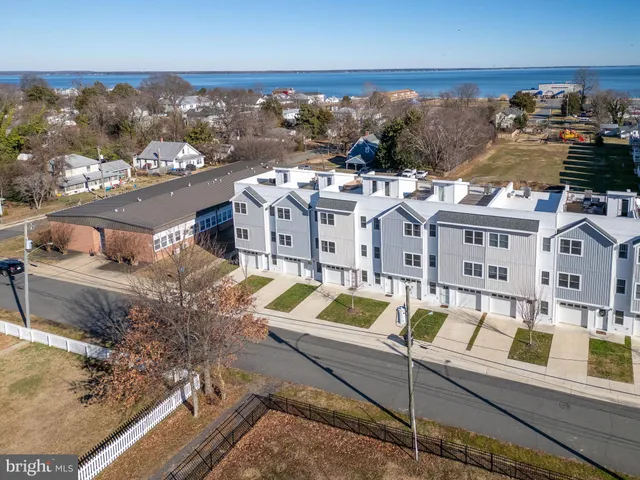 a view of a house with swimming pool and sitting area