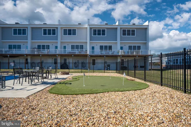 a view of a chairs and table in a terrace