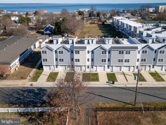 a view of a swimming pool with a lawn chairs