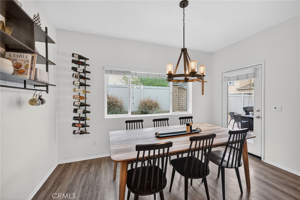 35462 Brown Galloway Lane Fallbrook, CA 92028 - Photo 15 of 63 a view of a dining room with furniture window and wooden floor