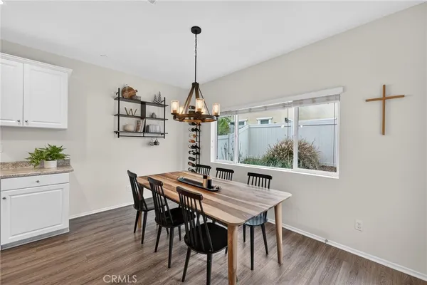 a bedroom with a large bed and a potted plant