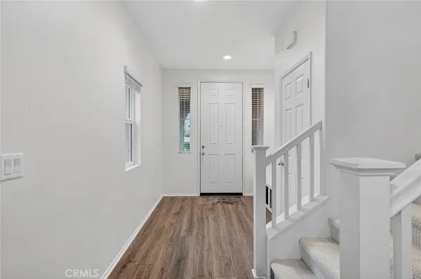 a view of a pathway of a house with wooden floor