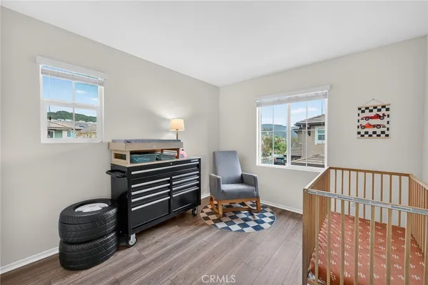 a view of a patio with couches table and chairs and potted plants