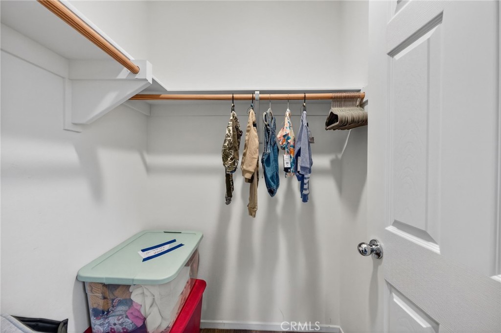 35462 Brown Galloway Lane Fallbrook, CA 92028 - Photo 24 of 63 a view of walk in closet with clothes and shoes