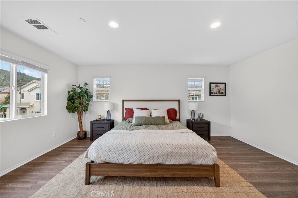 35462 Brown Galloway Lane Fallbrook, CA 92028 - Photo 39 of 63 a spacious bedroom with a bed and a potted plant