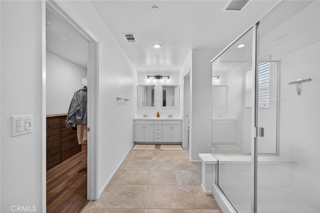 35462 Brown Galloway Lane Fallbrook, CA 92028 - Photo 40 of 63 a bathroom with a sink a mirror and shower