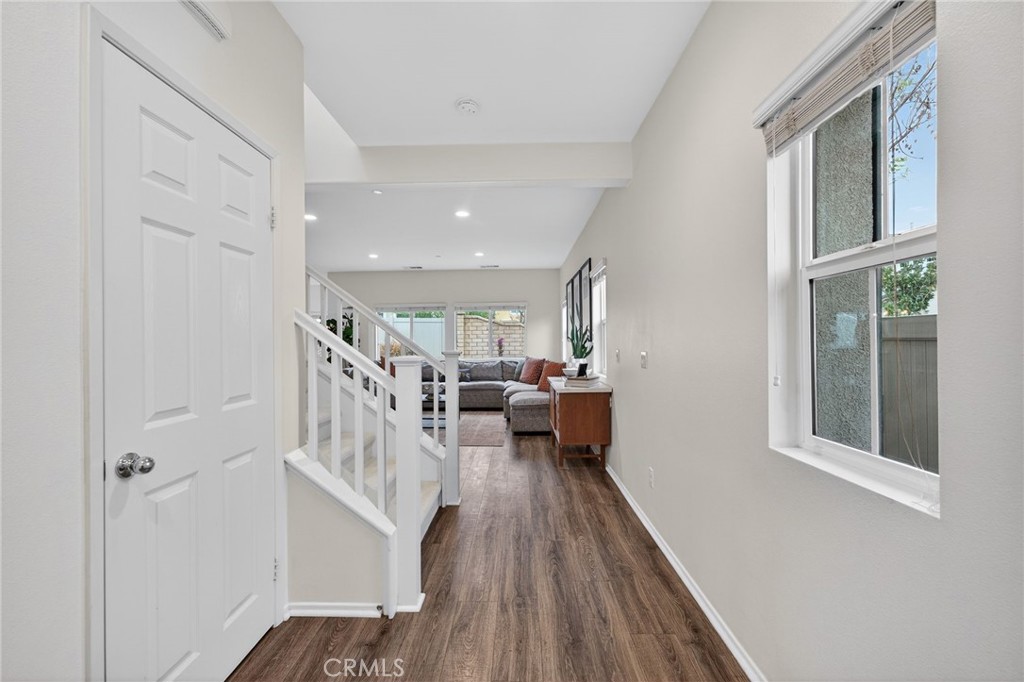 35462 Brown Galloway Lane Fallbrook, CA 92028 - Photo 4 of 63 a view of a hallway with wooden floor and furniture