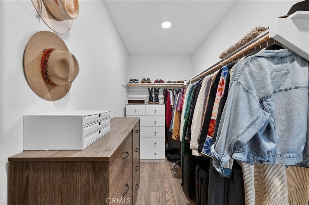 35462 Brown Galloway Lane Fallbrook, CA 92028 - Photo 45 of 63 a view of walk in closet with clothes and shoes