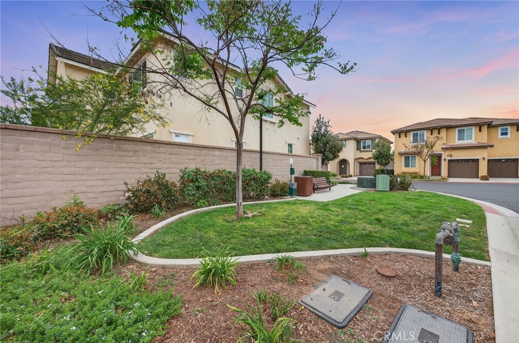 35462 Brown Galloway Lane Fallbrook, CA 92028 - Photo 53 of 63 a view of a garden with a bench in front of the house