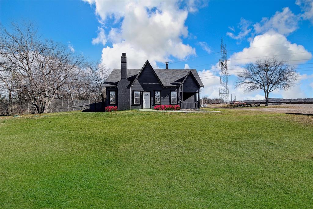 View of front of property with a chimney