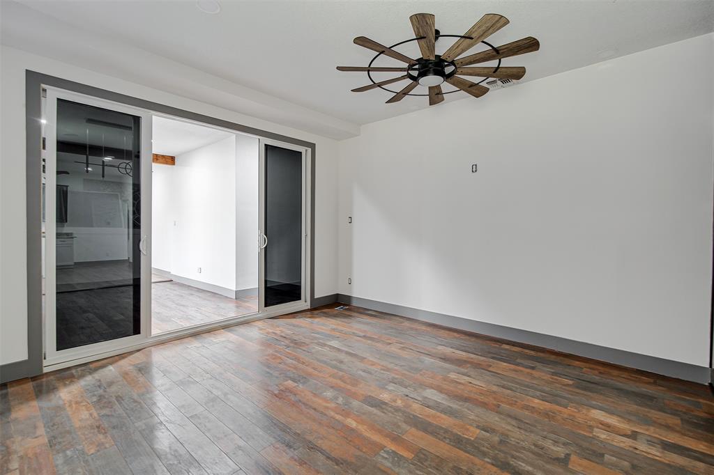 801 South Hampton Road Crowley, TX 76036 - Photo 10 of 26 Media room/living room featuring dark wood finished floors and ceiling fan
