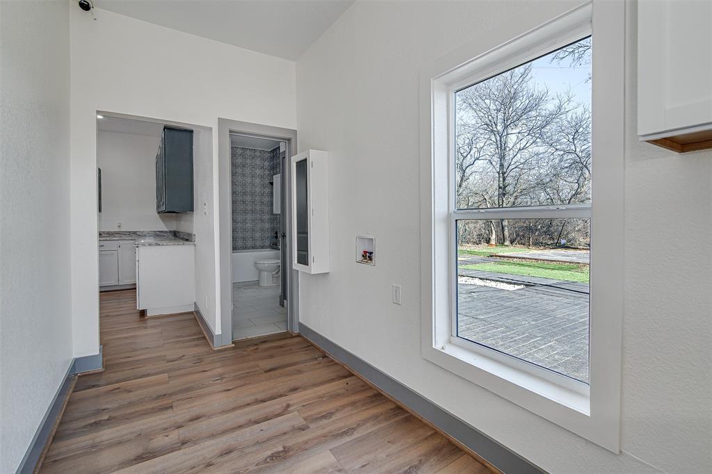801 South Hampton Road Crowley, TX 76036 - Photo 18 of 26 Laundry room and entrance from the side of the house.