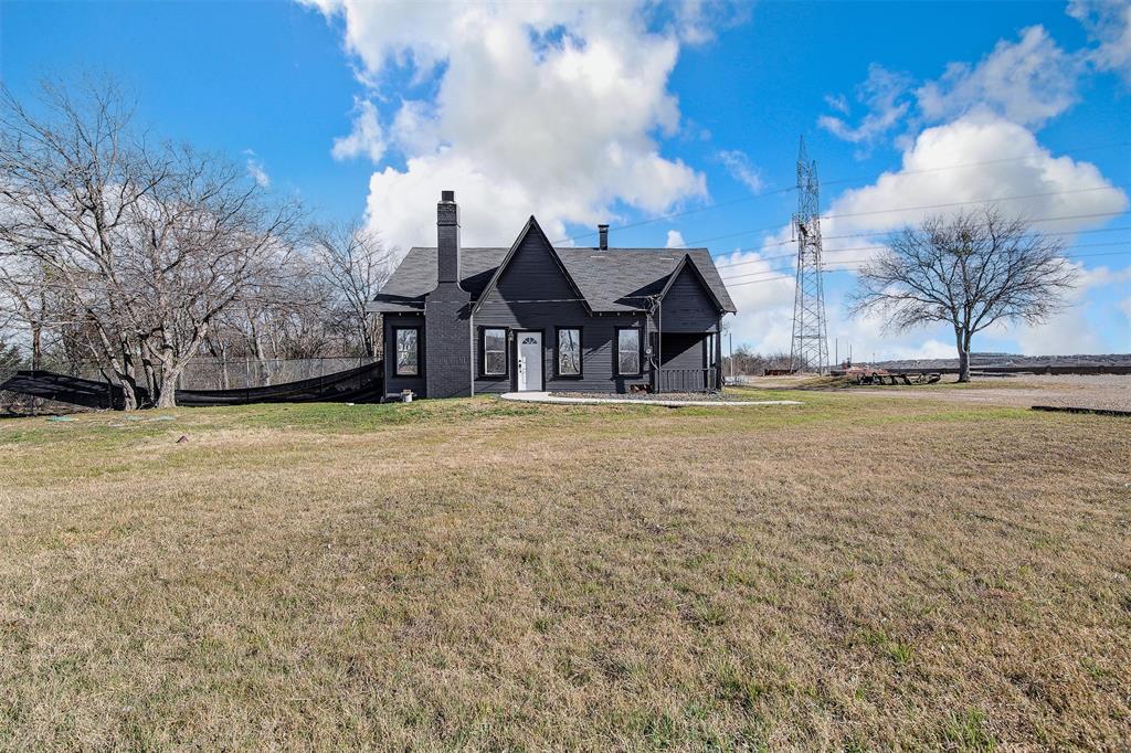 801 South Hampton Road Crowley, TX 76036 - Photo 23 of 26 View of front of property featuring a chimney and a front lawn
