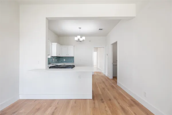 a living room with a wooden floor