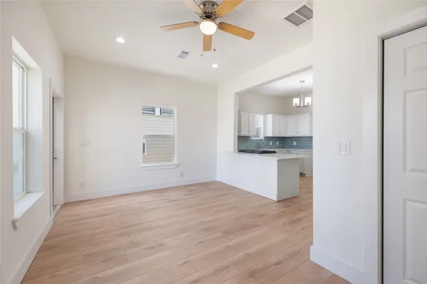 a view of kitchen with sink and wooden floor